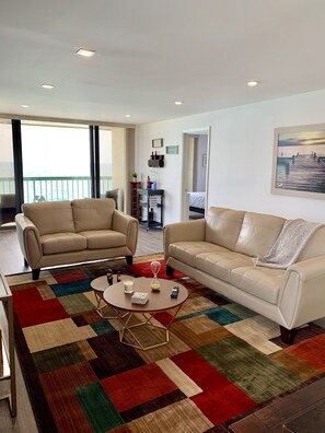 Living room area with wine bar.