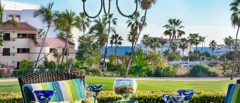 Back covered patio overlooking golf course with some ocean views