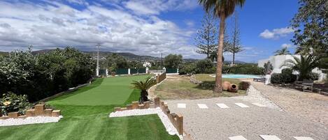 Golf Chipping and putting green, plus flowerbeds 