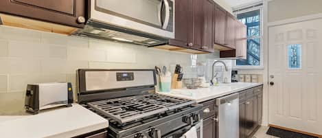 Full kitchen with new stainless steel appliances for all of your cooking.