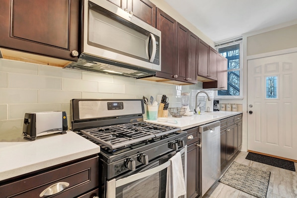 Full kitchen with new stainless steel appliances for all of your cooking.