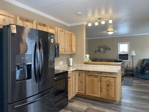 Fully stocked kitchen includes spices, condiments, cooking utensils and more 