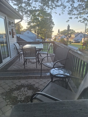 Deck under tree off dining room