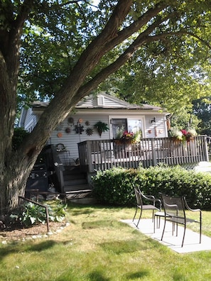 Deck with table shaded by big tree