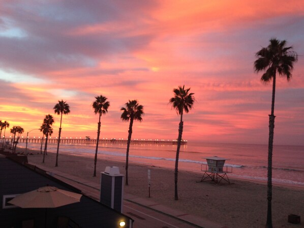 Sunrise reflection over the pier from the balcony