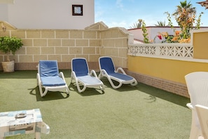Sun loungers on terrace