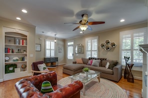 Large, open, and light-filled living room. Great space to relax and reload.