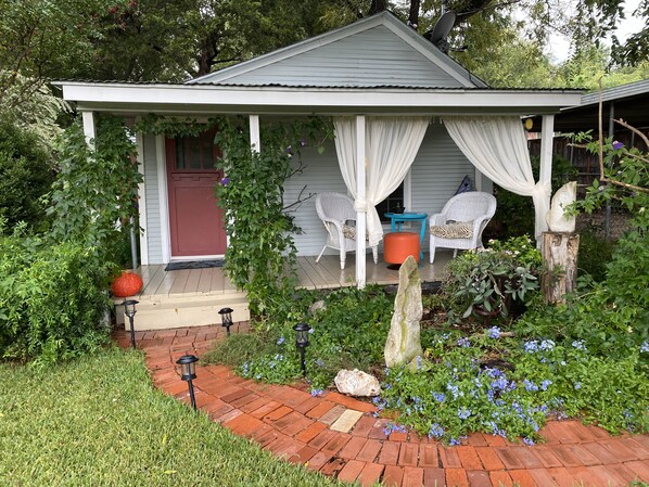 Front of cottage in fall!! Lots of Passion flowers = lots of butterflies!