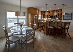 Dining table and kitchen from front door