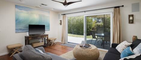 Terrific living room looking out to front yard deck and BBQ