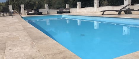 New pool & terrace. Views to the west of the escarpment behind the villa 