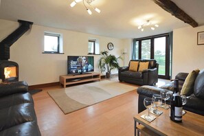 Ground floor: Large sitting room with a wood burning stove