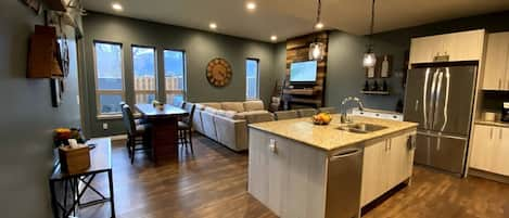 Open kitchen/living/dining area so everyone can be together even while cooking!