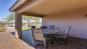 Covered Backyard with view of the golf course looking down the 7th Tee box.  
