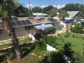 Looking down on fence separating wildlife area and back yard.  Solar Power!