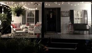 Front view of farmhouse at night