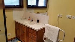 Large bathroom with bath and separate shower.