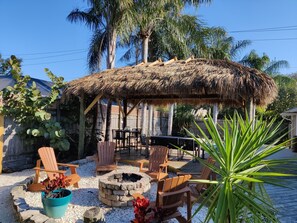 Toast marshmallows over the fire pit or have a meal under the tiki hut!