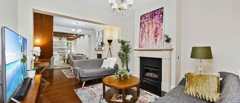 Open plan living and dining area with gas fireplace