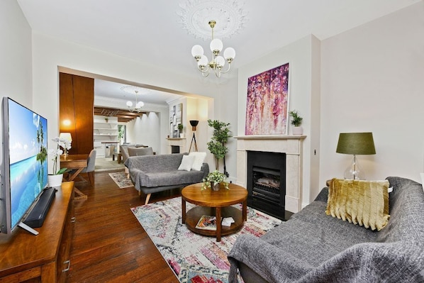 Open plan living and dining area with gas fireplace