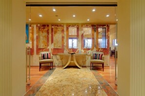 Gorgeous granite and marble tiles and hard wood floors in the foyer