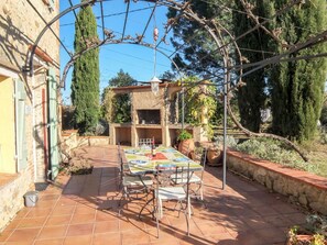 Plant, Table, Furniture, Sky, Chair, Building, Outdoor Table, Outdoor Furniture, Shade, Tree