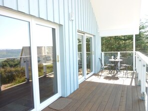 Lodge balcony with patio table and chairs