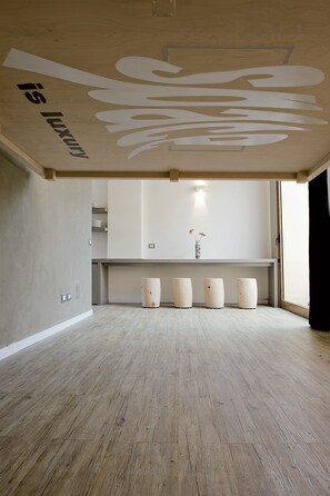 The double bed when raised to the ceiling