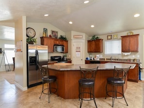 FANTASTIC OPEN KITCHEN WITH LARGE BAR SEATING, S/S DELUXE APPLIANCES