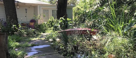 Your private entrance-french doors open to an upper pond, a 14 foot stream.