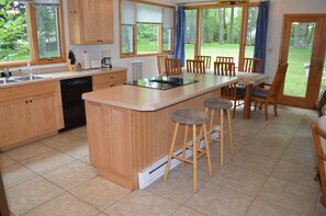 Bar seating and kitchen of the Lake House