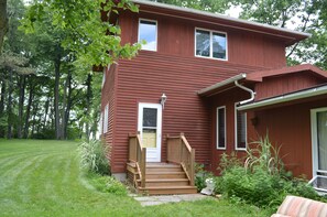 Exterior of the Lake House.  Lake and beach are beyond the Lake House. 