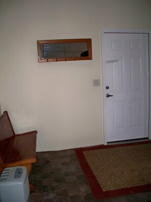 View from garage of door leading up to loft.