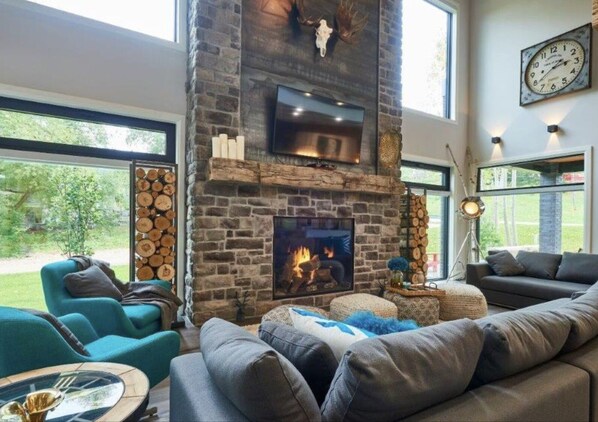 Grand Family room and stone gas fireplace