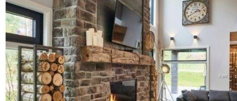 Stone fireplace in open living space