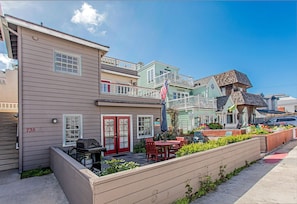 Street view with public parking in front of the home.