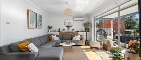 Downstairs living room with smart TV and Netflix.