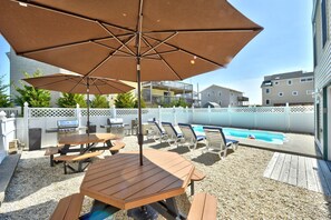 BBQ Area with Two Natural Gas Stainless Weber Grills and two picnic tables