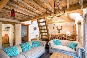 Curl up on the sofas under the characterful exposed beams and relax