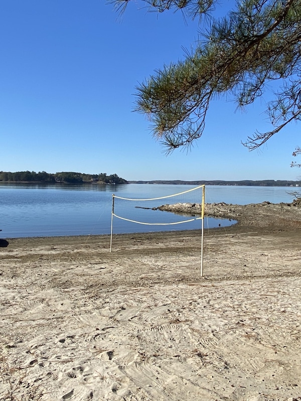 Lower lake level leaves a large beach for volley ball