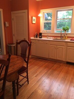 Kitchen, overlooks deck, yard and pool.