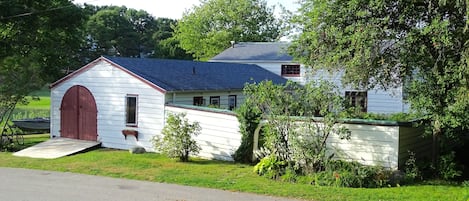 Curbside view of house and courtyard