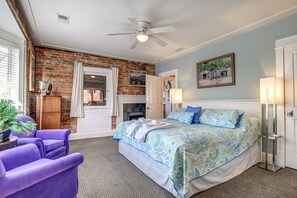 Main bedroom, exposed brick Bay window overlooking harbor