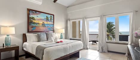 Master bedroom (2nd floor) features king bed, en suite bath, A/C, TV, balcony