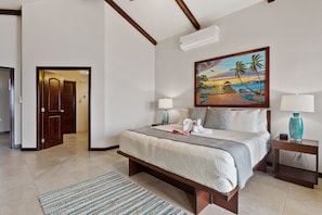 Master bedroom (2nd floor) features en suite bath, TV, A/C, balcony, ocean view 