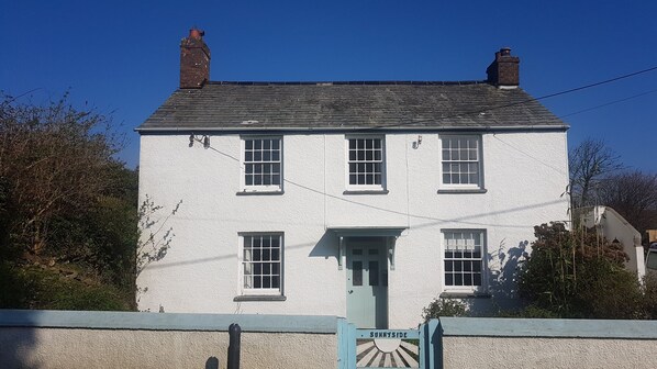 South facing cottage with pretty enclosed front garden. parking to the side.