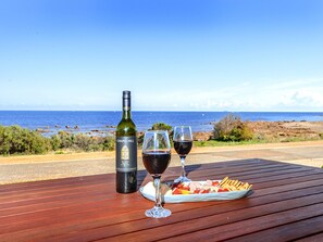 Unique advantage allowing guests to drive directly onto the sand, perfect for effortless family beach days and loading/unloading gear. (Wine pictured is for styling purposes only.)