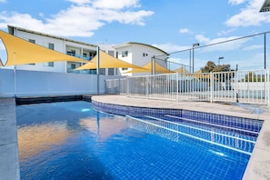 Guests can enjoy a heated swimming pool, full-size tennis court, and ping pong table—all within the secure apartment complex.