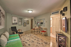 The living area has a sleeper sofa.