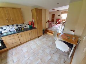 Fully fitted kitchen with oven, hob, dishwasher, fridge and freezer